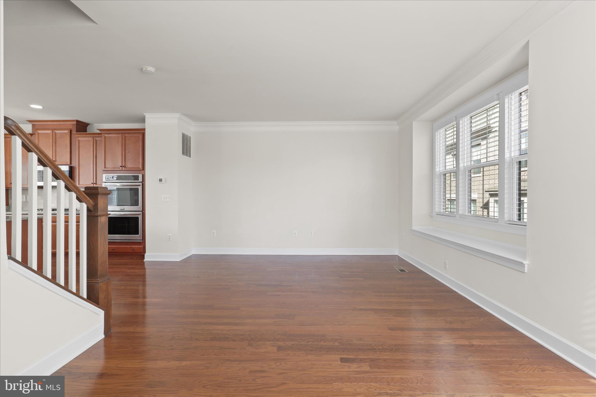 3755 Signal Knob Court Falls Church, VA 22041 - Photo 11 of 46 a view of an empty room with wooden floor and a window