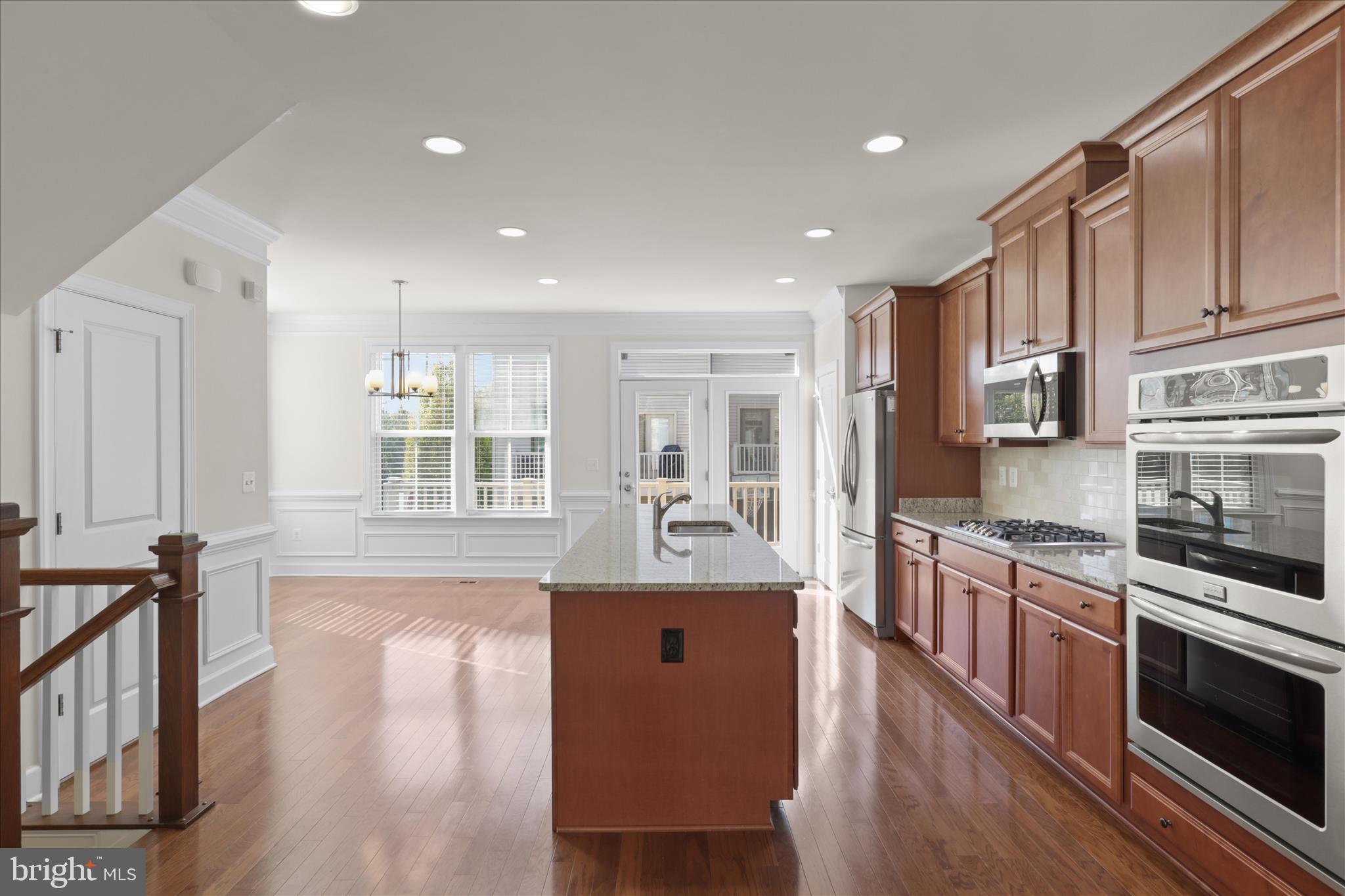 3755 Signal Knob Court Falls Church, VA 22041 - Photo 12 of 46 a large kitchen with stainless steel appliances granite countertop a stove and a wooden floors