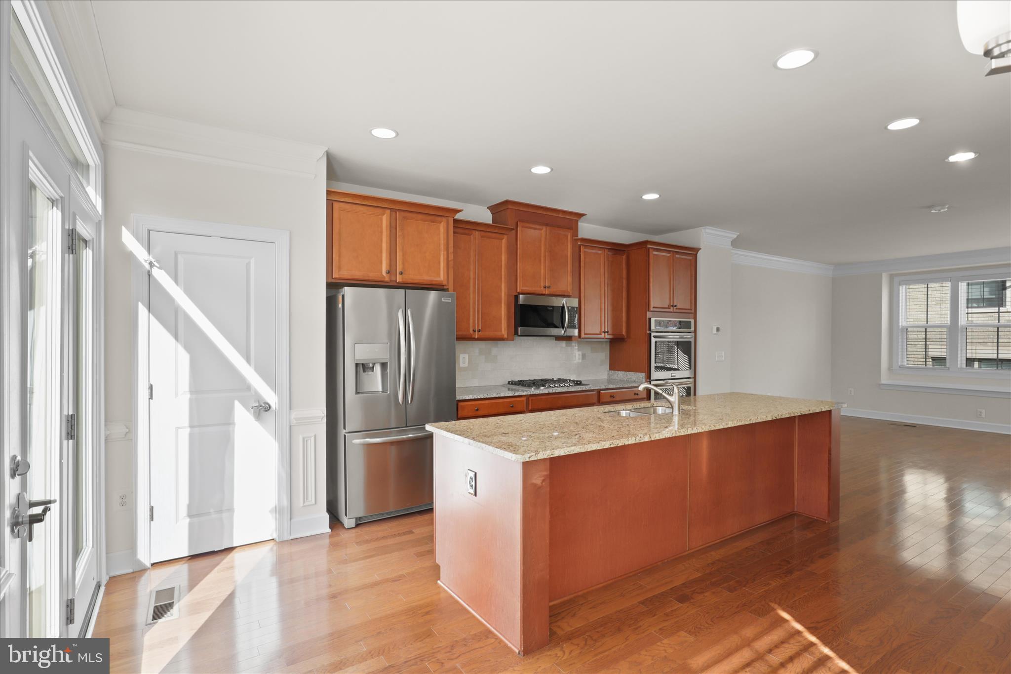 3755 Signal Knob Court Falls Church, VA 22041 - Photo 16 of 46 a kitchen with stainless steel appliances granite countertop a refrigerator sink and cabinets