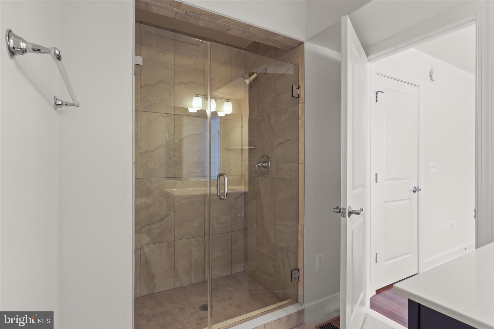 3755 Signal Knob Court Falls Church, VA 22041 - Photo 22 of 46 a bathroom with a glass shower door