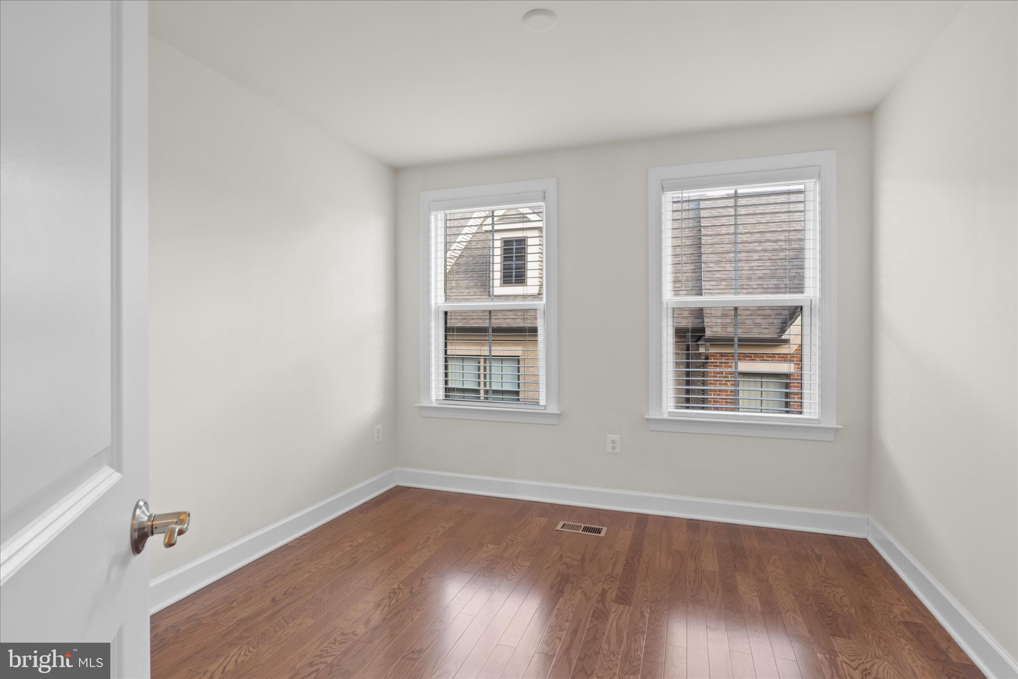 3755 Signal Knob Court Falls Church, VA 22041 - Photo 24 of 46 an empty room with wooden floor and windows