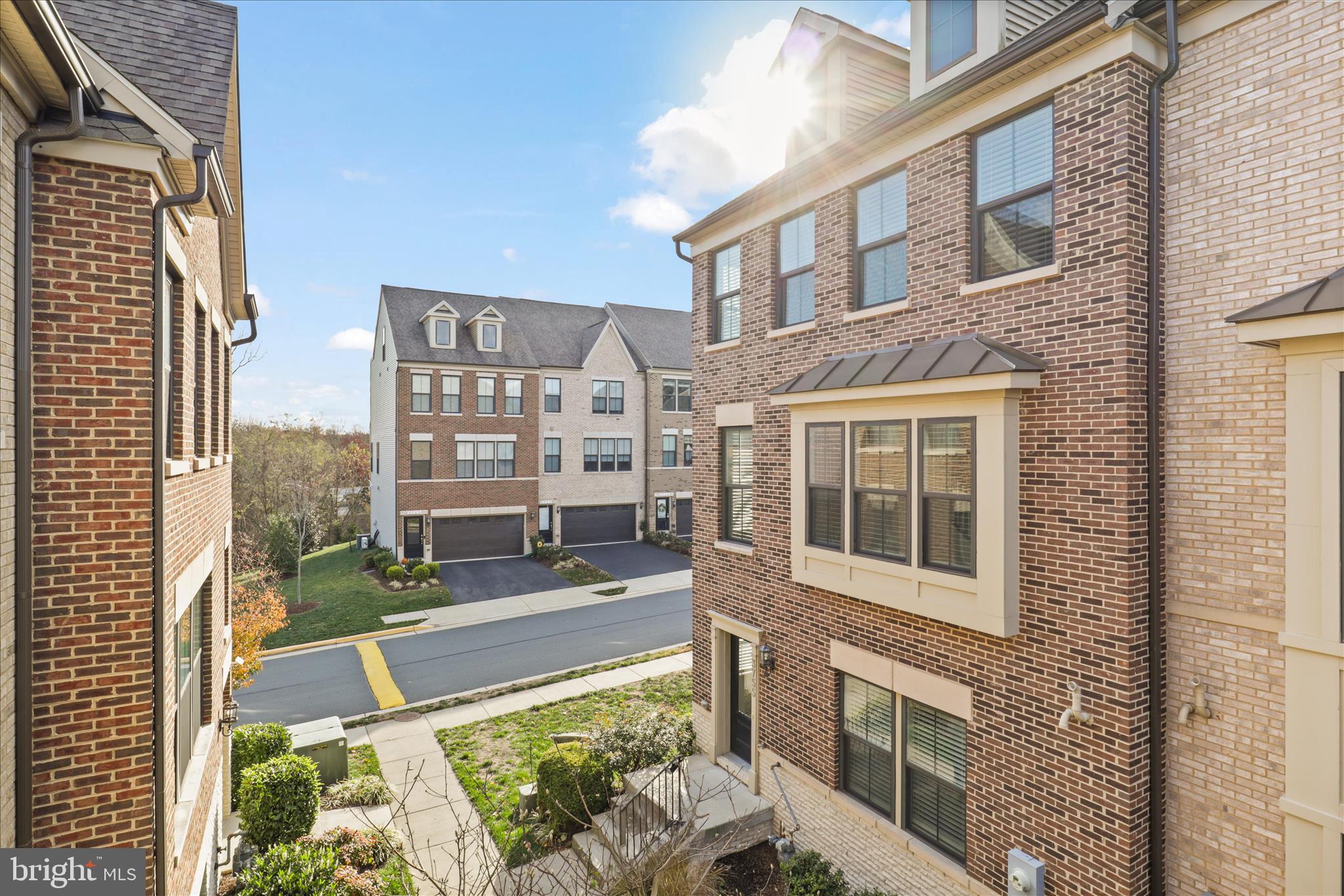 3755 Signal Knob Court Falls Church, VA 22041 - Photo 3 of 46 a front view of a residential apartment building with a yard