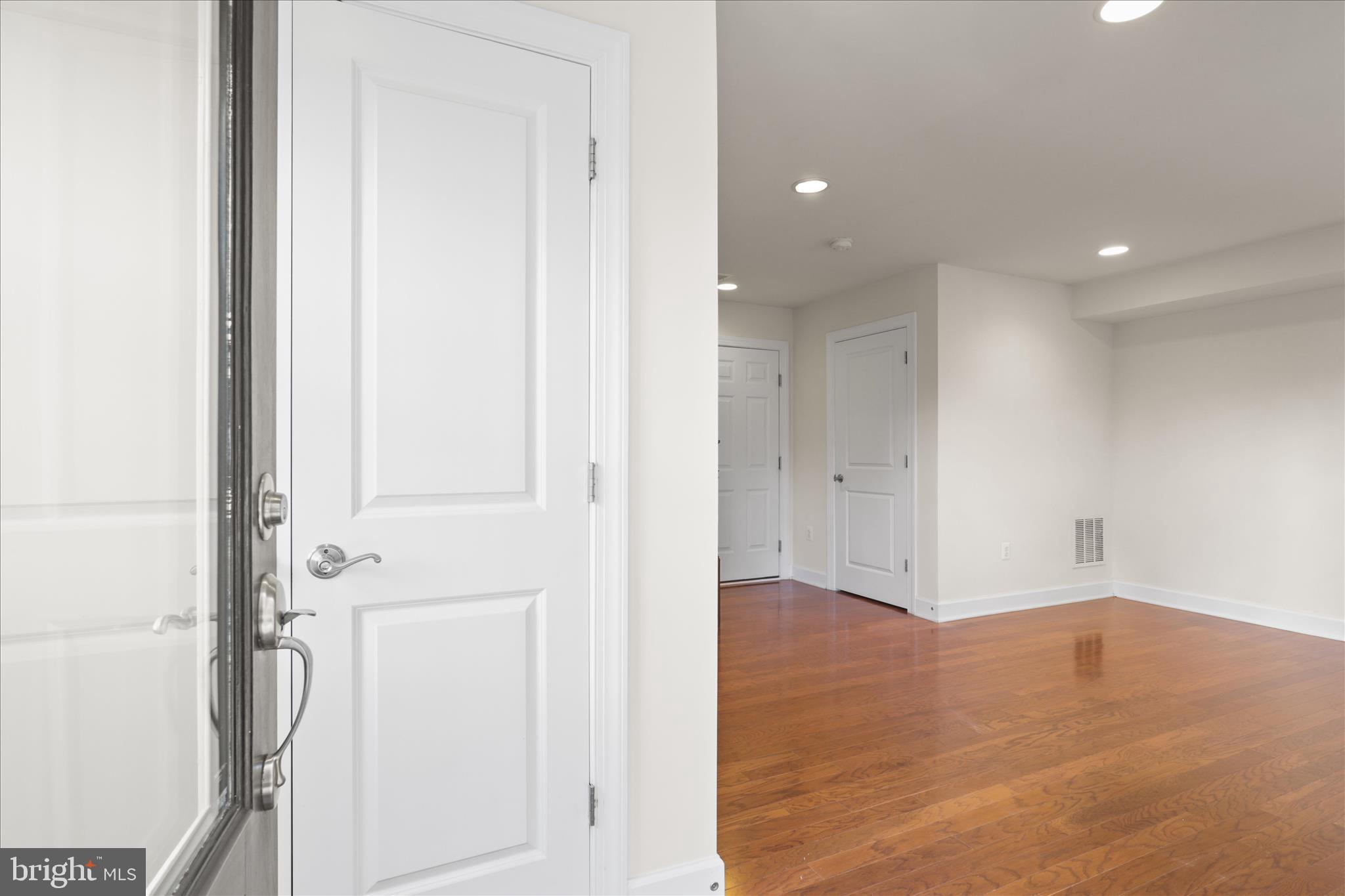 3755 Signal Knob Court Falls Church, VA 22041 - Photo 5 of 46 an empty room with wooden floor and white doors