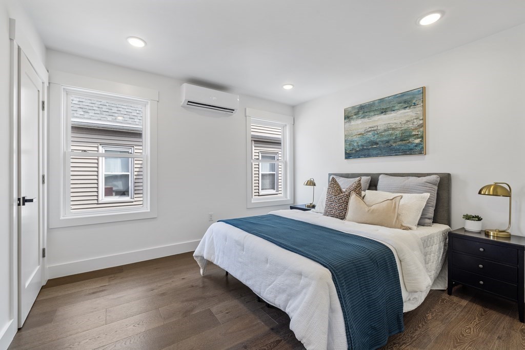 58 Simpson Avenue, Unit 2 Somerville, MA 02144 - Photo 14 of 28 a bedroom with a bed and a window