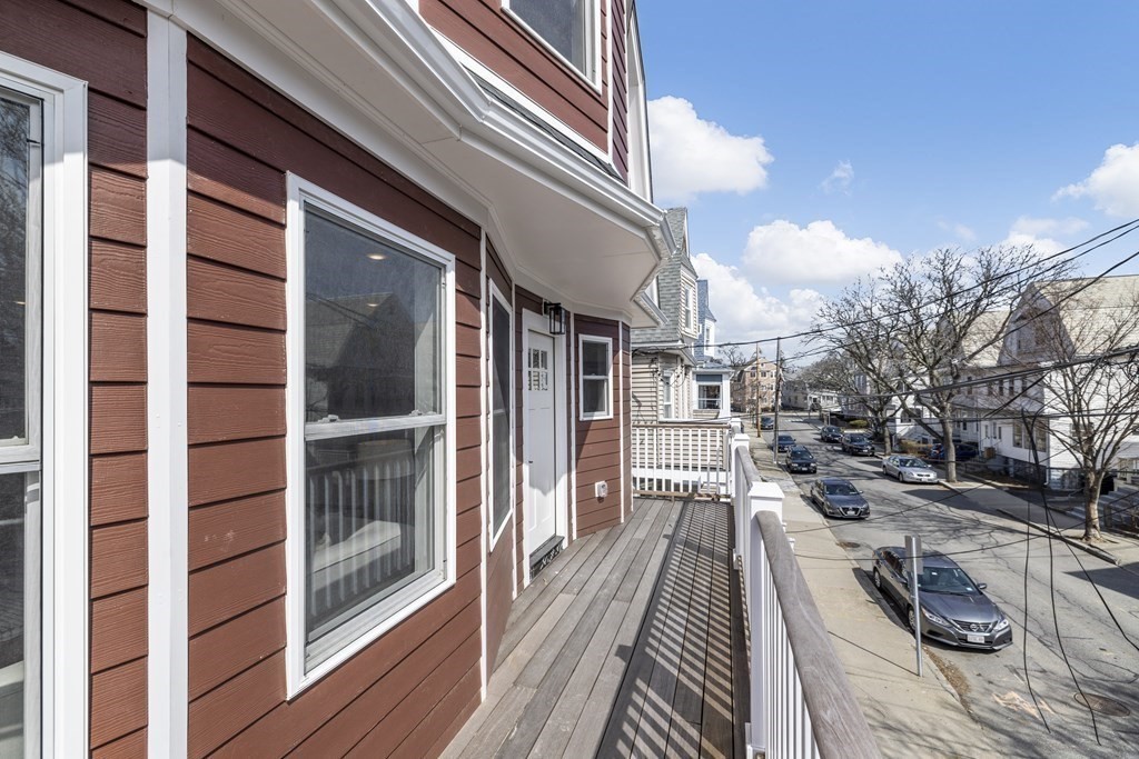 58 Simpson Avenue, Unit 2 Somerville, MA 02144 - Photo 23 of 28 a view of a balcony with wooden floor