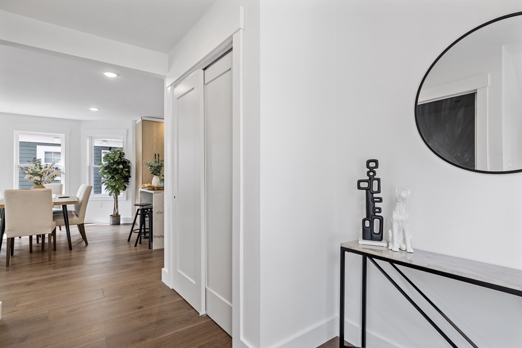 58 Simpson Avenue, Unit 2 Somerville, MA 02144 - Photo 3 of 28 a view of a hallway with wooden floor and dining room
