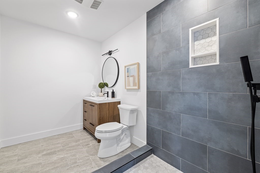 58 Simpson Avenue, Unit 2 Somerville, MA 02144 - Photo 4 of 28 a bathroom with a toilet and a sink