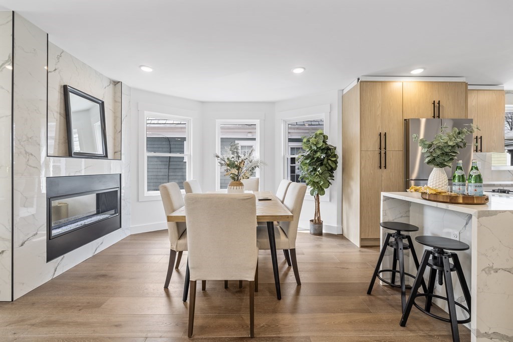 58 Simpson Avenue, Unit 2 Somerville, MA 02144 - Photo 5 of 28 a view of a dining room with furniture window and wooden floor