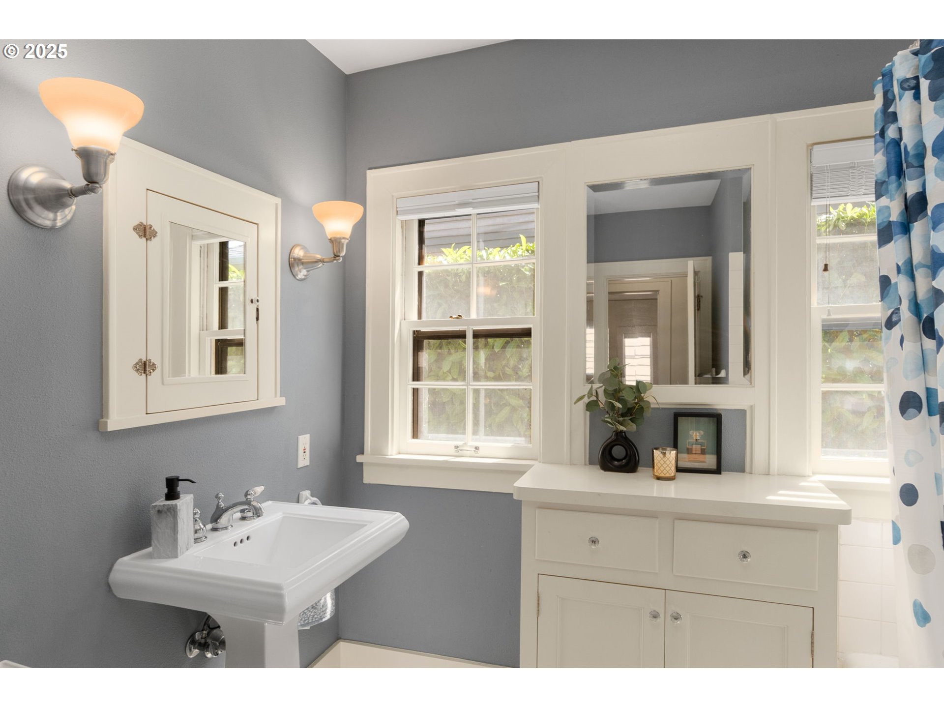 6807 Southeast 34th Avenue Portland, OR 97202 - Photo 14 of 39 a bathroom with a sink and a mirror