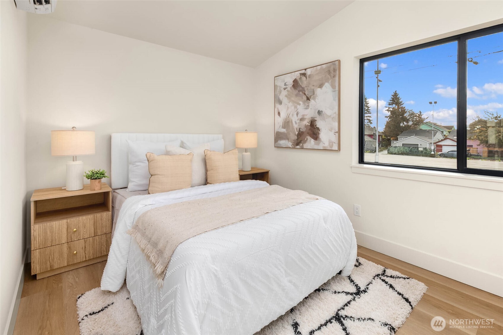 3812 South Eddy Street Seattle, WA 98118 - Photo 15 of 19 a bedroom with a bed and a painting on the wall