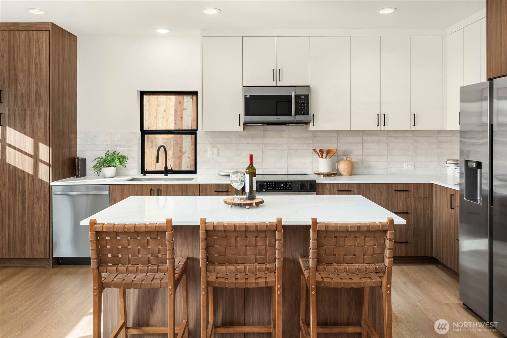 3812 South Eddy Street Seattle, WA 98118 - Photo 4 of 19 a kitchen with stainless steel appliances granite countertop a sink stove and microwave