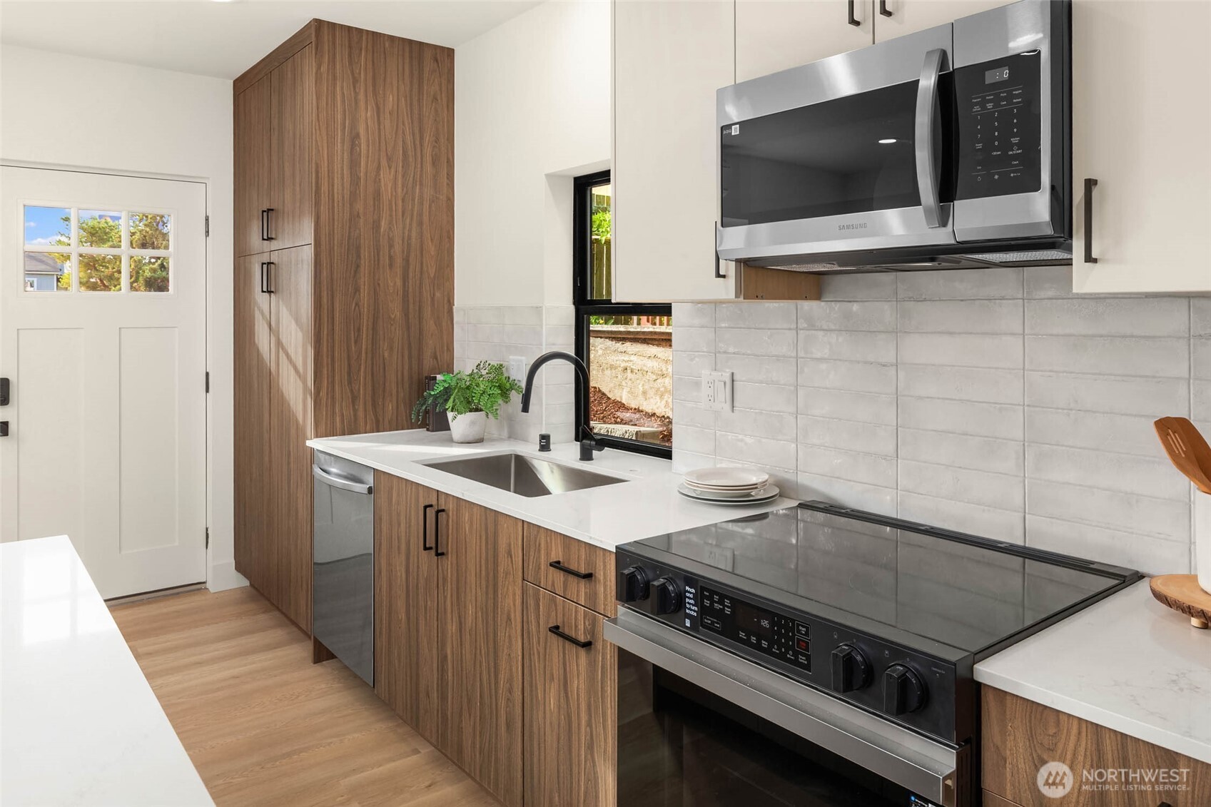 3812 South Eddy Street Seattle, WA 98118 - Photo 7 of 19 a kitchen with a stove and a microwave
