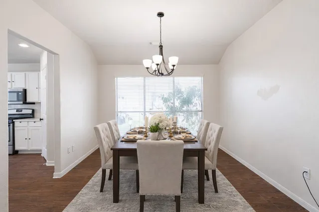 a view of kitchen with refrigerator and fireplace