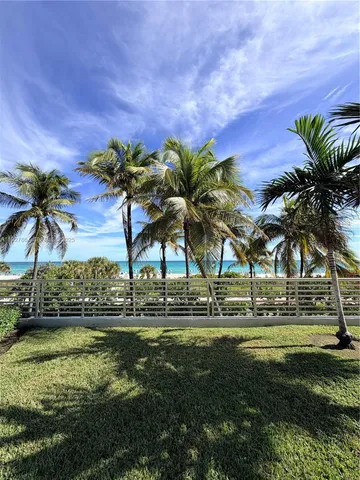 a view of a yard with a fountain