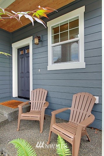 325 Field Place Northeast Renton, WA 98059 - Photo 2 of 13 a front view of a house with outdoor seating