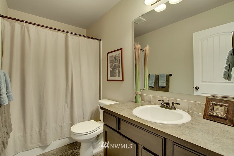 325 Field Place Northeast Renton, WA 98059 - Photo 12 of 13 a bathroom with a sink toilet and mirror