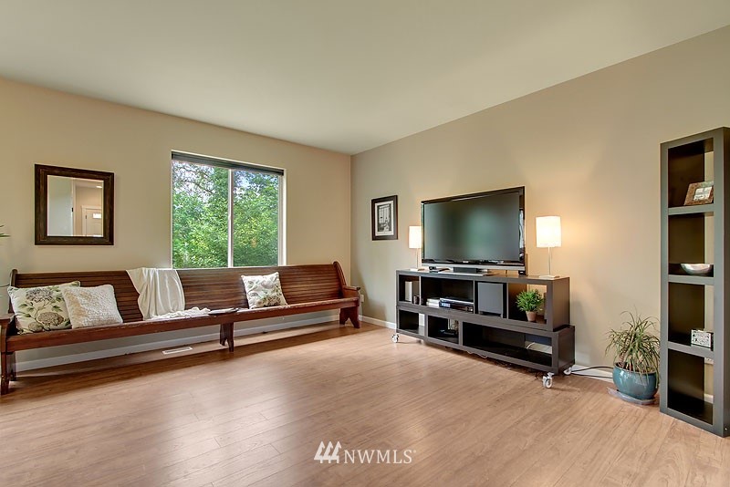 325 Field Place Northeast Renton, WA 98059 - Photo 4 of 13 a living room with furniture and a flat screen tv