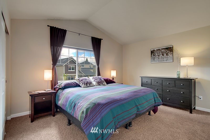 325 Field Place Northeast Renton, WA 98059 - Photo 9 of 13 a bedroom with a bed and a window