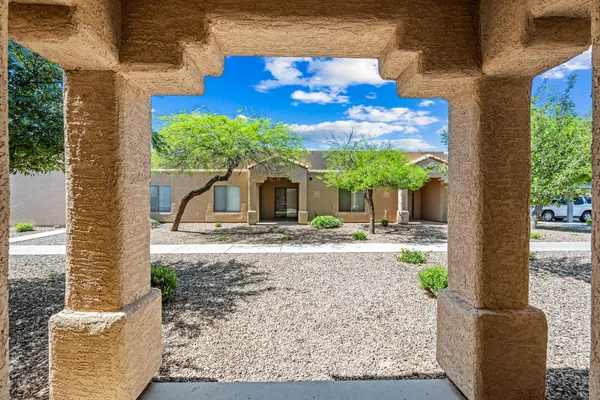 a front view of a house with garden