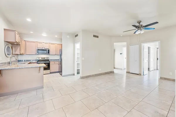 a view of kitchen with appliances and cabinets