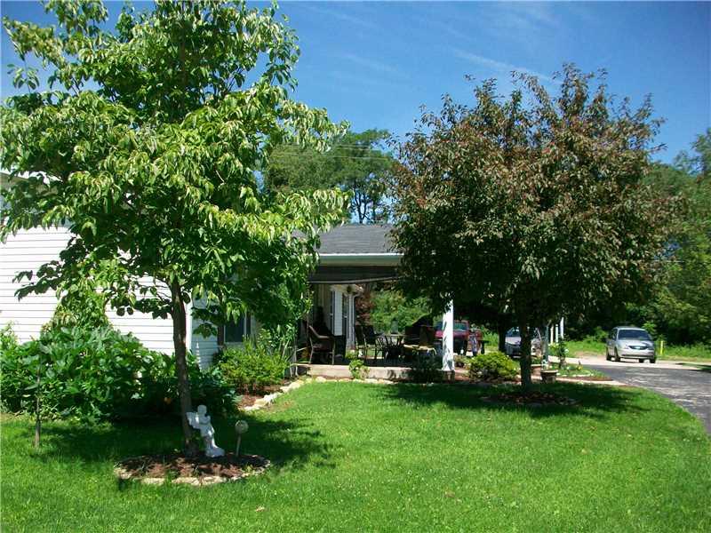 2020 Renton Road Plum, PA 15239 - Photo 9 of 13 Yard/Garden. side view of porch and yard