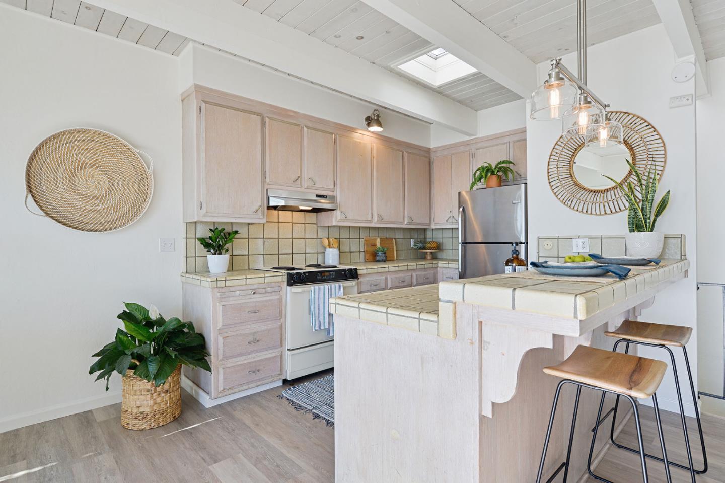 615 Beach Drive Aptos, CA 95003 - Photo 11 of 37 a open kitchen with a white stove top oven and a white cabinets