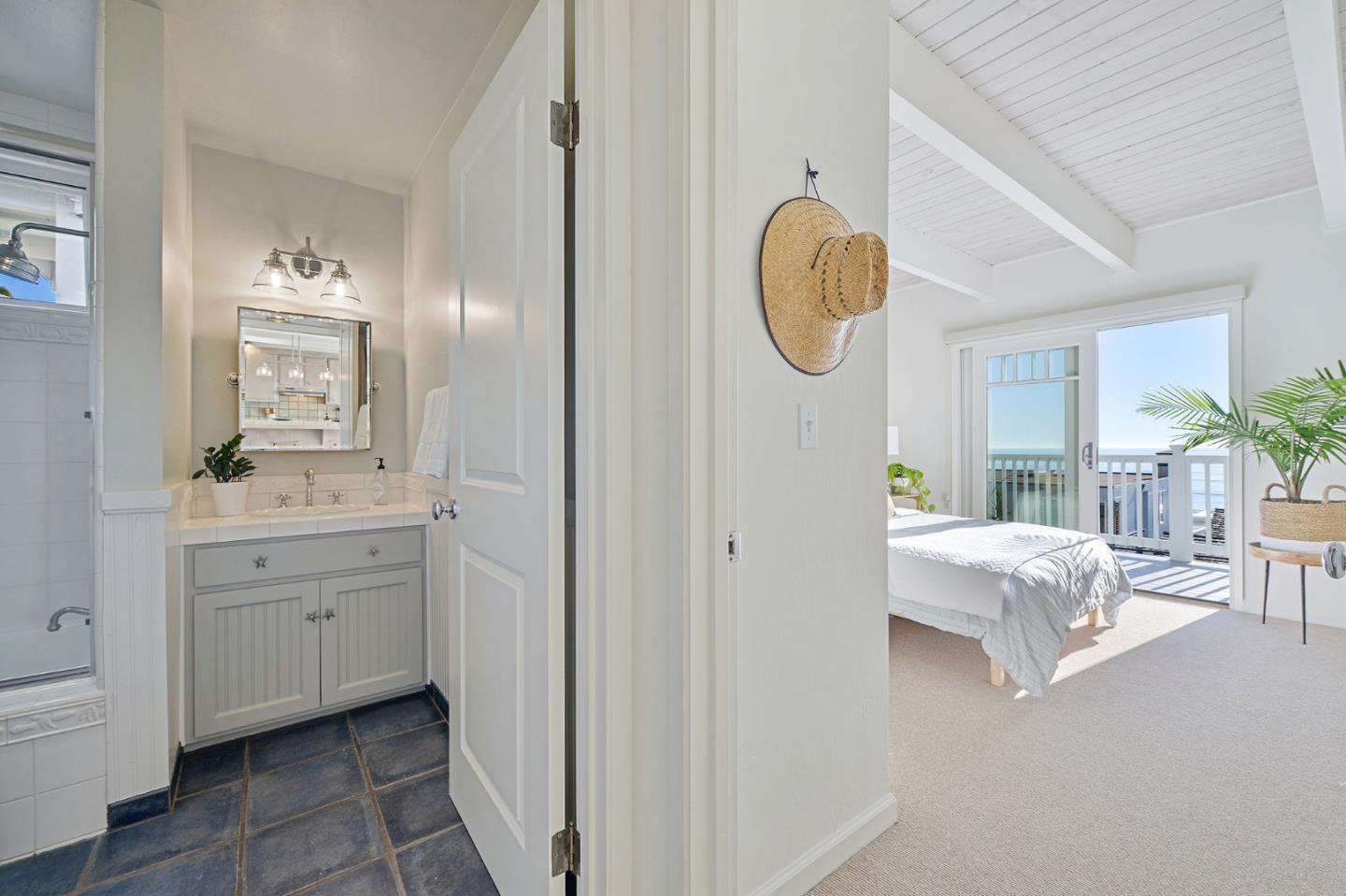 615 Beach Drive Aptos, CA 95003 - Photo 16 of 37 a spacious bathroom with a double vanity sink and a mirror
