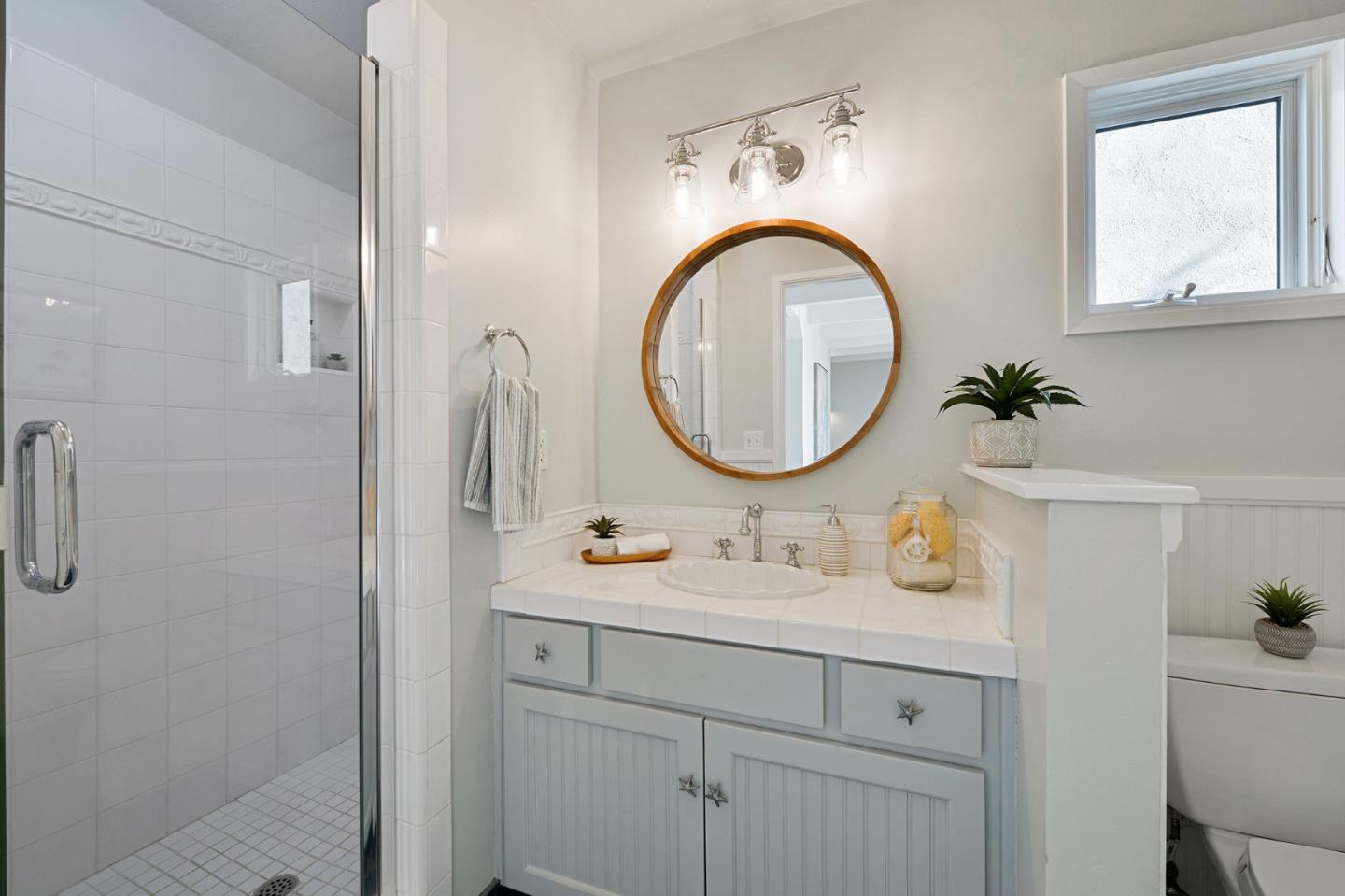 615 Beach Drive Aptos, CA 95003 - Photo 22 of 37 a bathroom with a sink double vanity and a mirror