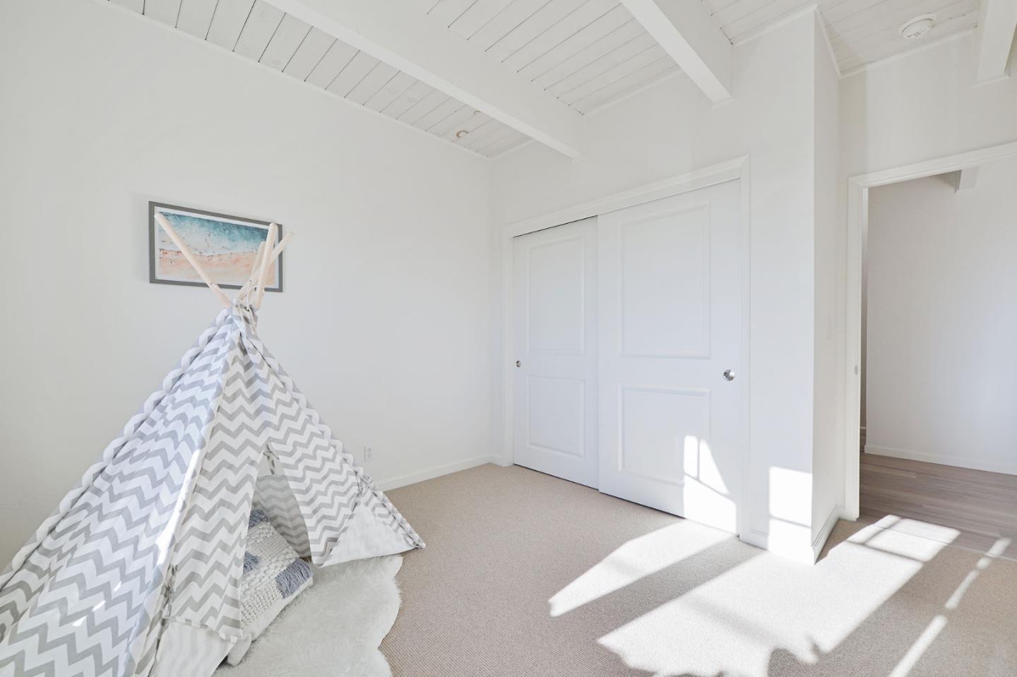 615 Beach Drive Aptos, CA 95003 - Photo 26 of 37 a very nice looking room with a bed