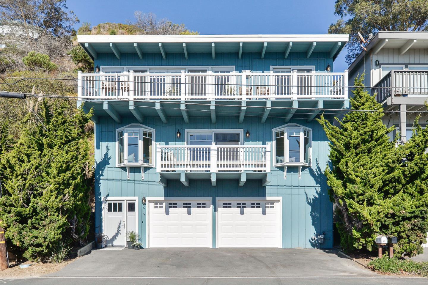 615 Beach Drive Aptos, CA 95003 - Photo 31 of 37 a front view of a house with a yard and parking space