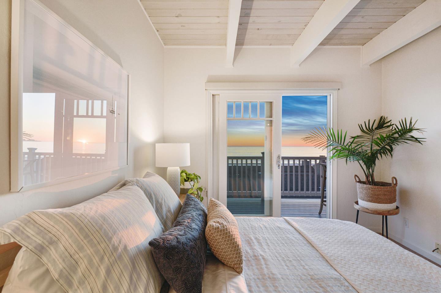 615 Beach Drive Aptos, CA 95003 - Photo 33 of 37 a bedroom with a large bed and a potted plant