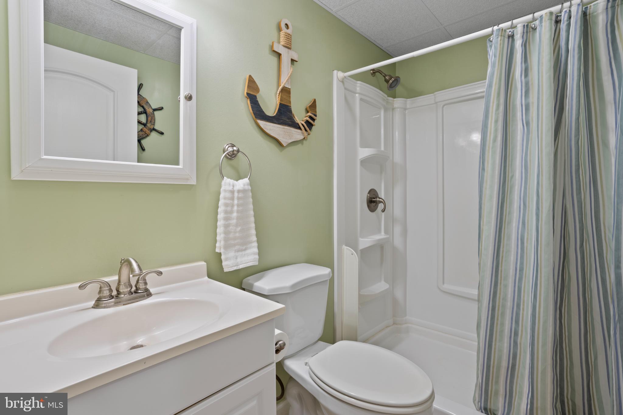 1860 Battery Lane Owings, MD 20736 - Photo 102 of 120 a bathroom with a sink toilet and shower