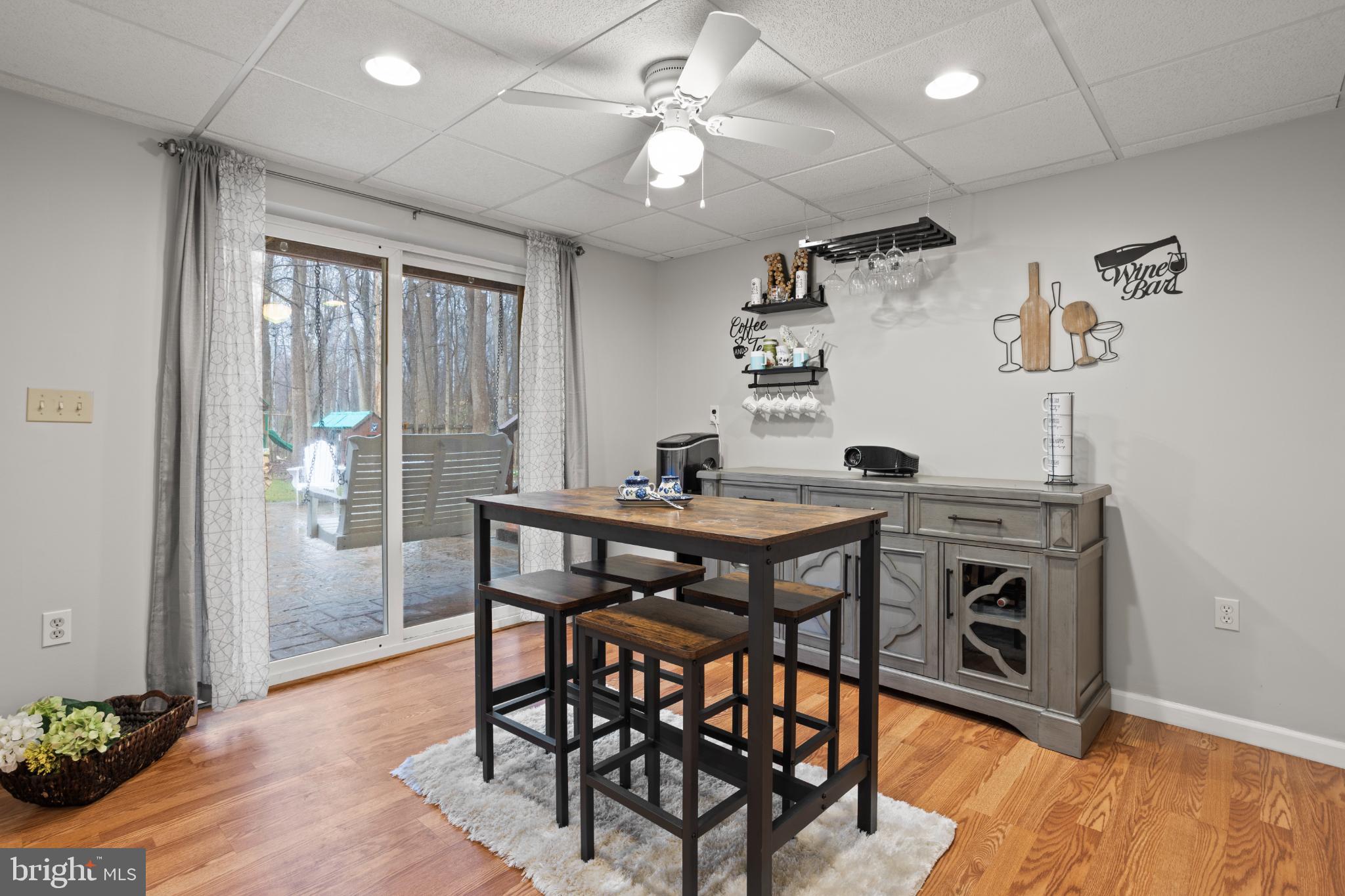 1860 Battery Lane Owings, MD 20736 - Photo 103 of 120 a view of a dining room with furniture window and wooden floor