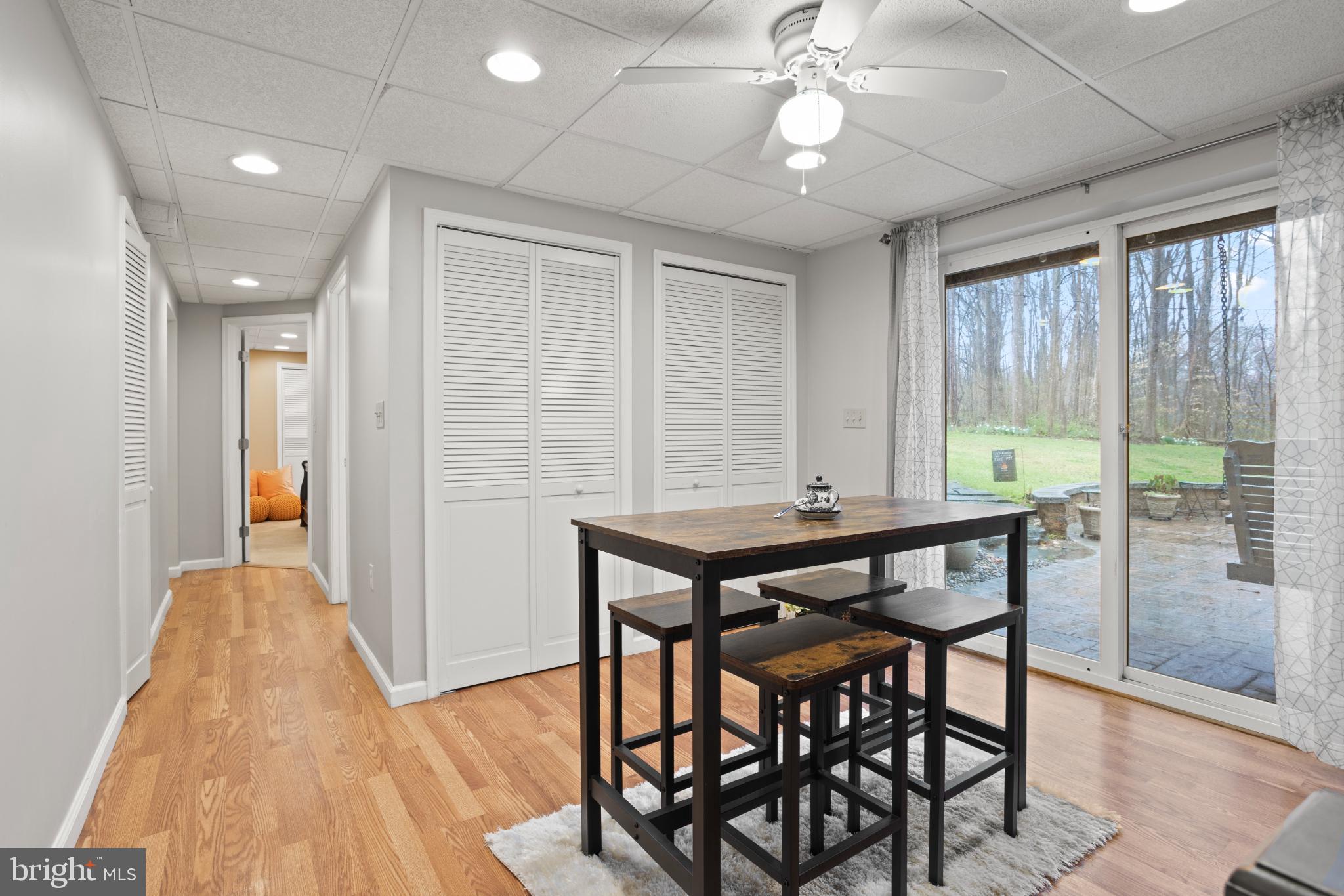 1860 Battery Lane Owings, MD 20736 - Photo 104 of 120 a view of a dining room with furniture and wooden floor