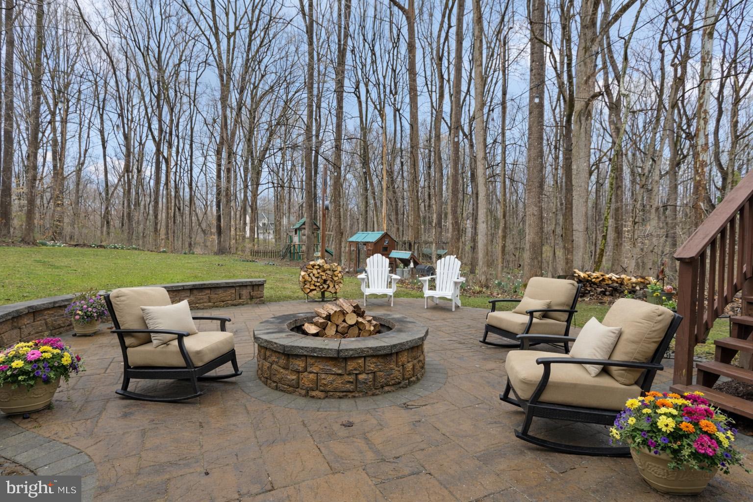 1860 Battery Lane Owings, MD 20736 - Photo 116 of 120 Backyard Firepit virtually staged with flowers
