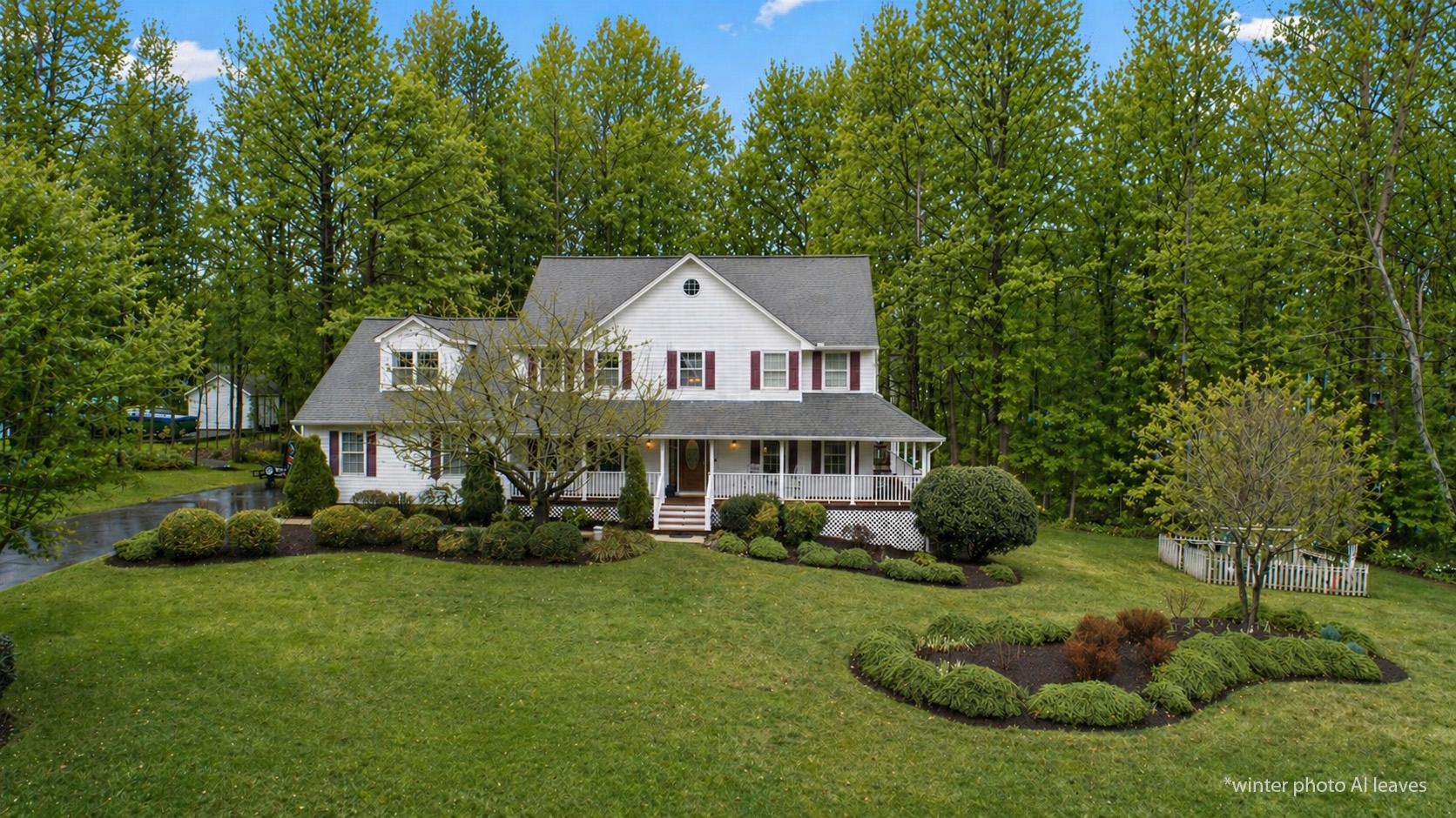 1860 Battery Lane Owings, MD 20736 - Photo 2 of 120 a front view of a house with a yard and green space