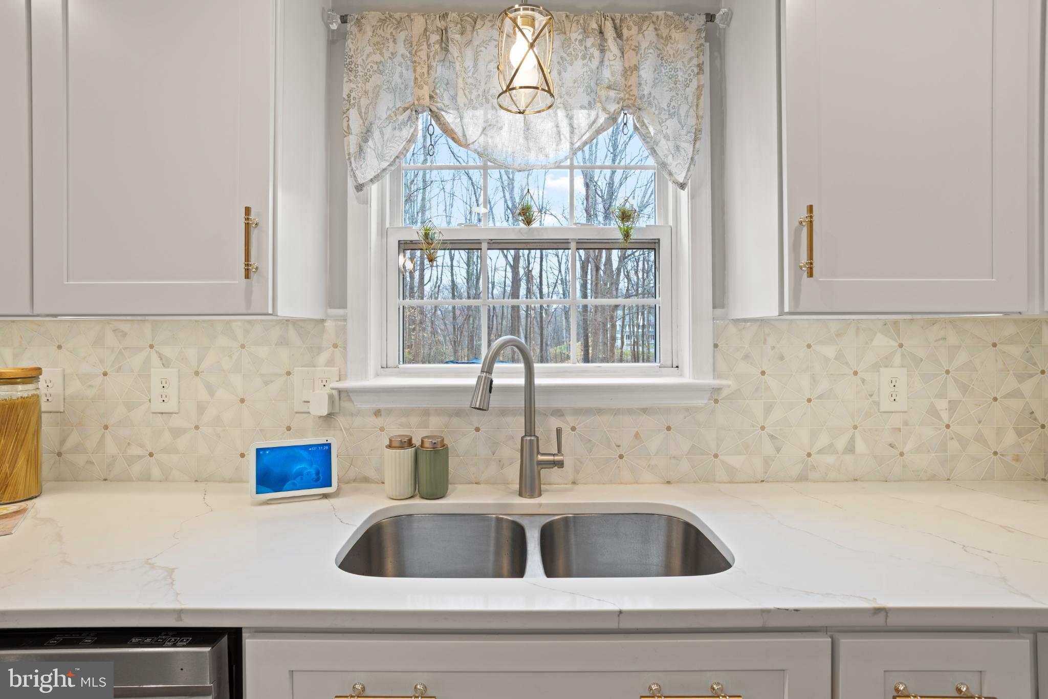 1860 Battery Lane Owings, MD 20736 - Photo 26 of 120 a kitchen with a sink and a window