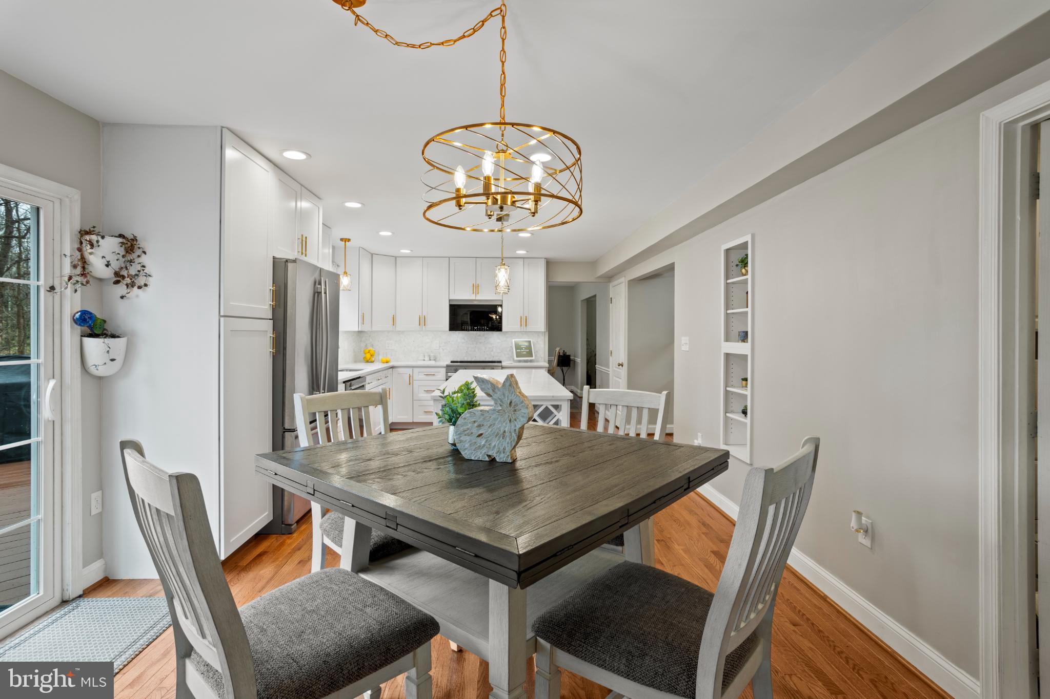 1860 Battery Lane Owings, MD 20736 - Photo 27 of 120 a view of a dining room and a table and chairs