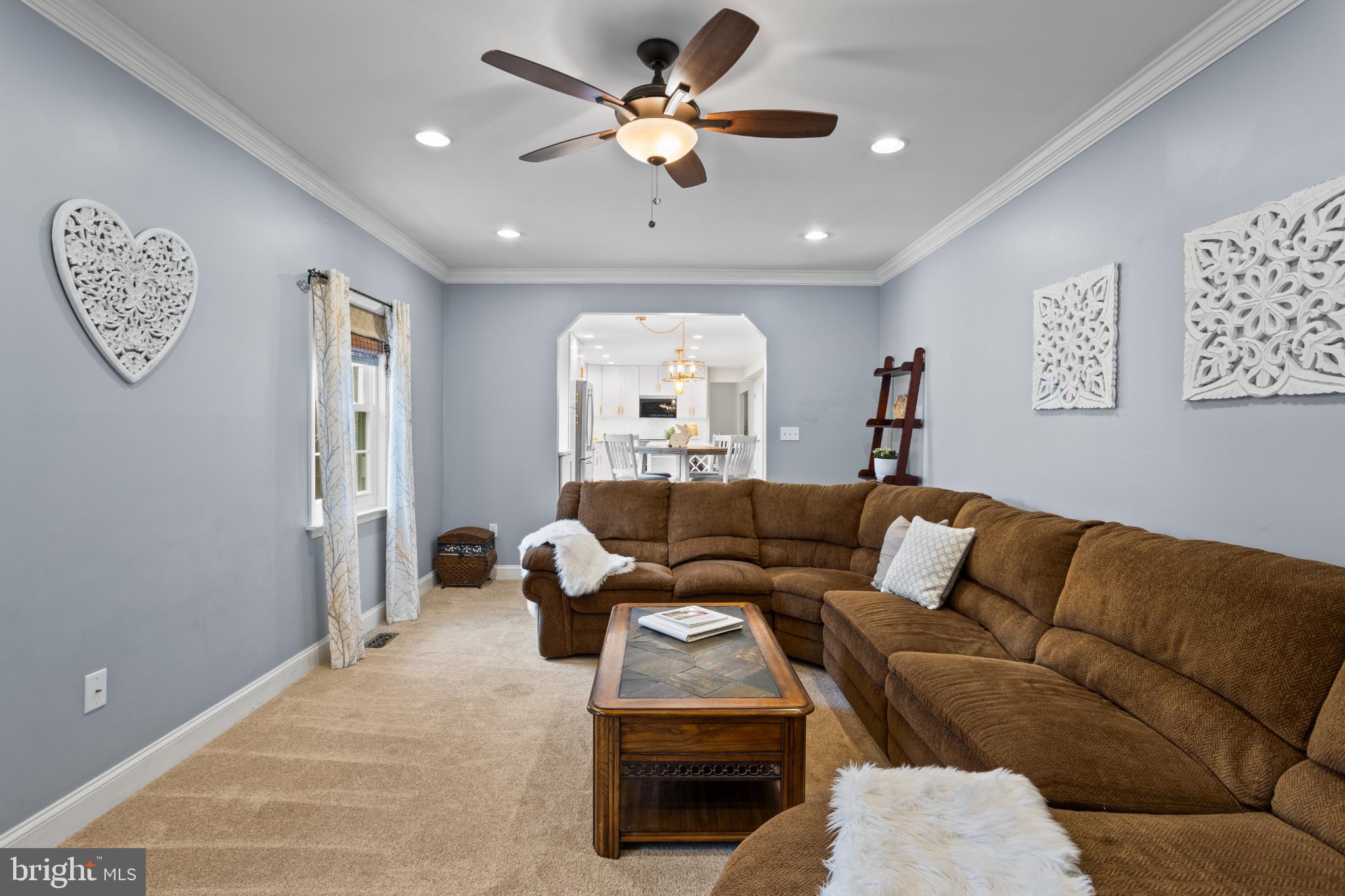 1860 Battery Lane Owings, MD 20736 - Photo 33 of 120 a living room with furniture and a chandelier