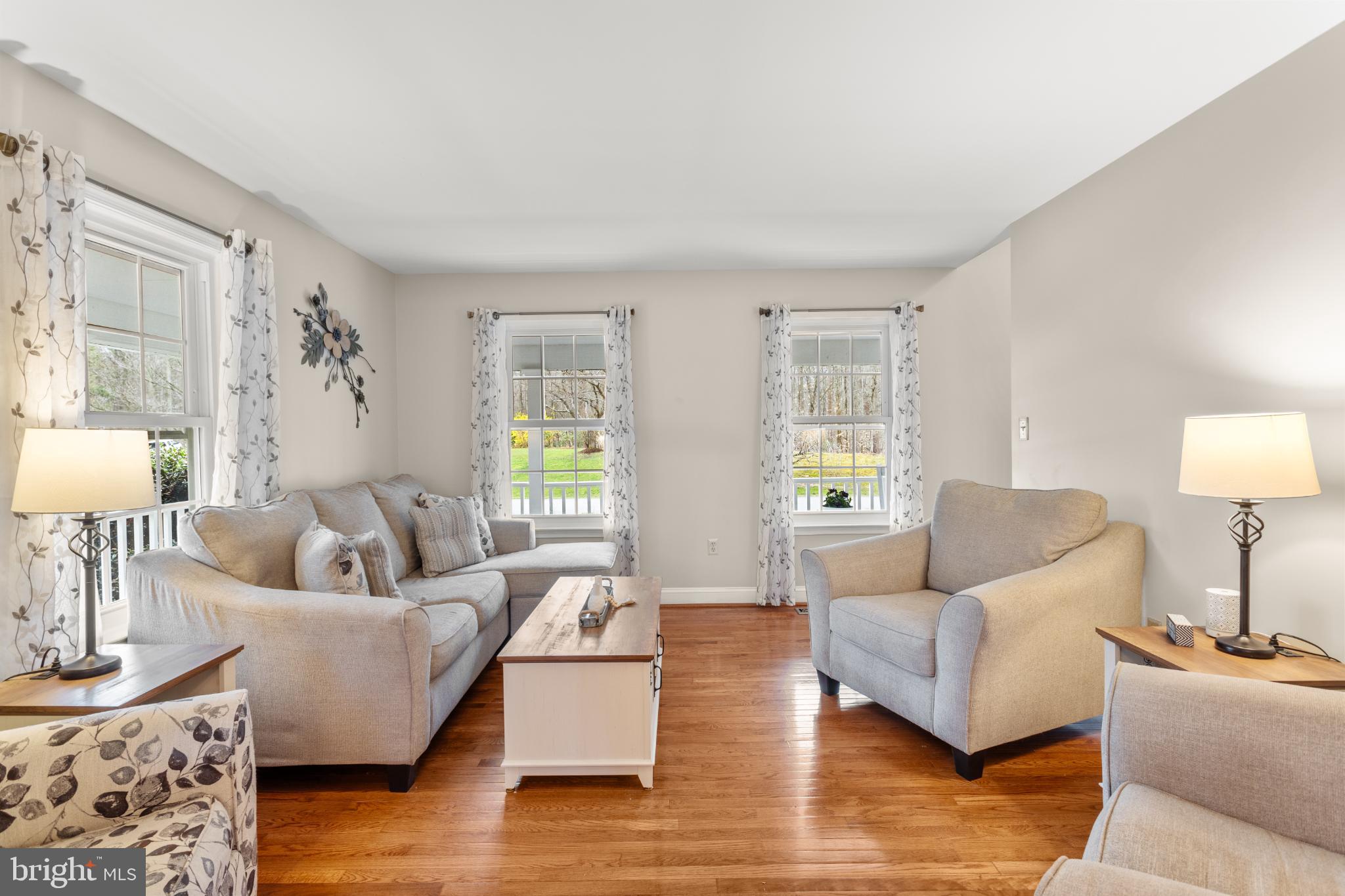 1860 Battery Lane Owings, MD 20736 - Photo 42 of 120 a living room with furniture and a wooden floor