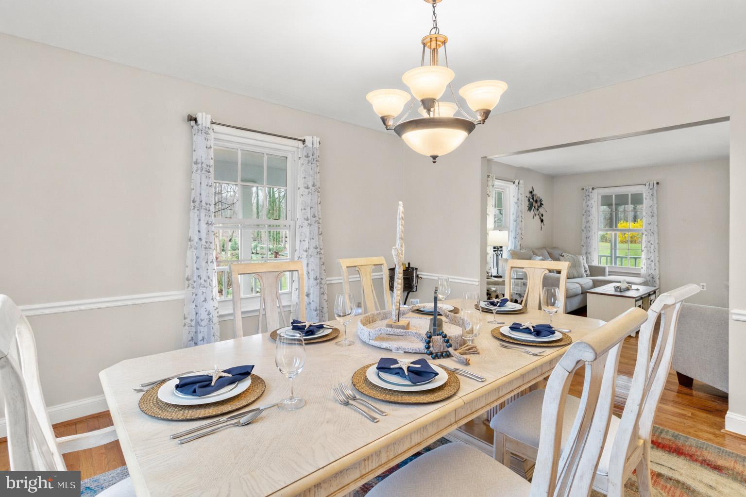 1860 Battery Lane Owings, MD 20736 - Photo 46 of 120 a view of a dining room with furniture a chandelier and wooden floor