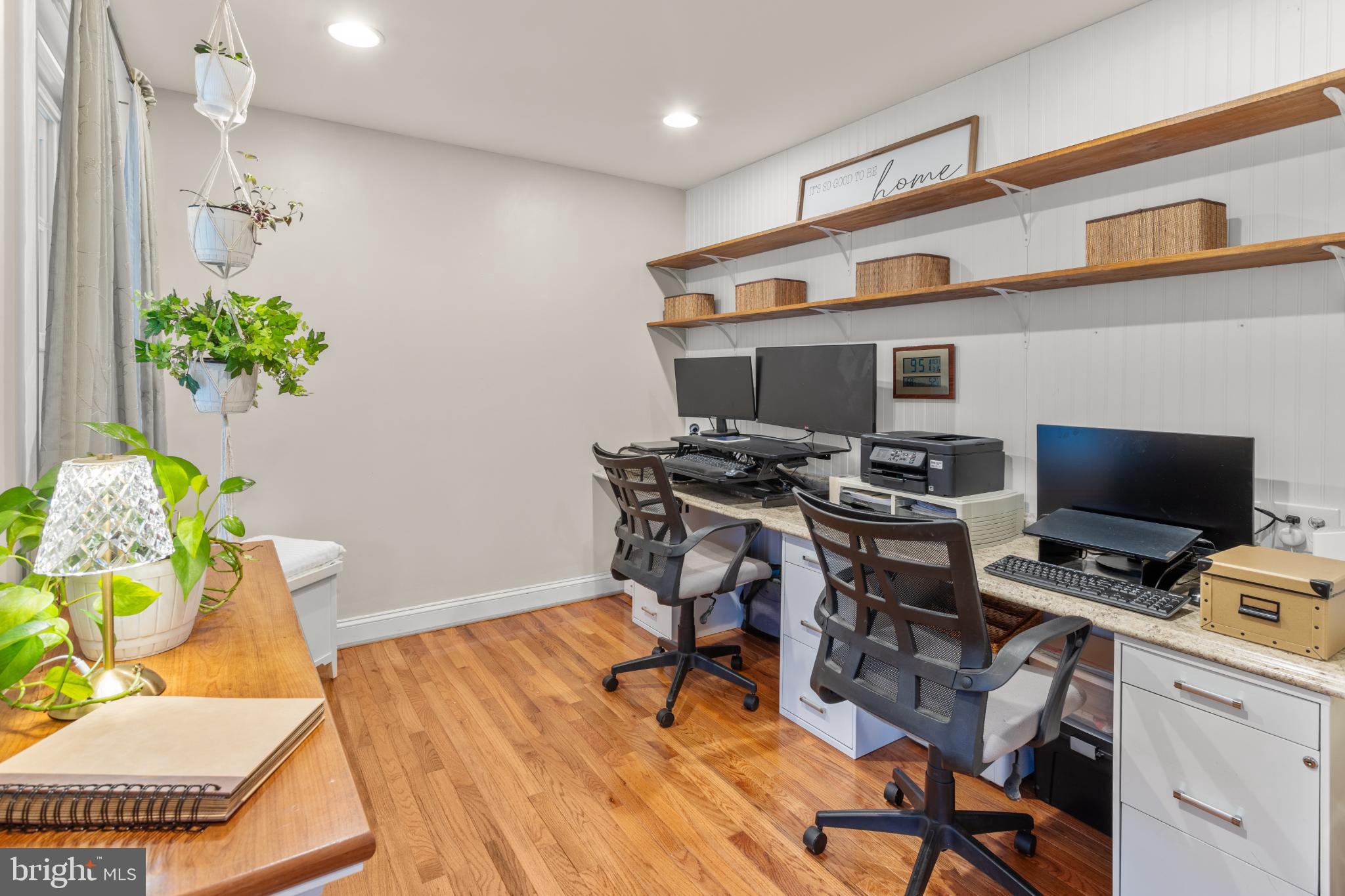 1860 Battery Lane Owings, MD 20736 - Photo 48 of 120 a view of a workspace with furniture and a potted plant