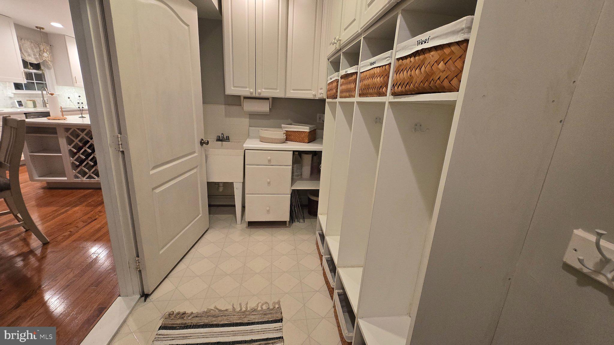 1860 Battery Lane Owings, MD 20736 - Photo 53 of 120 a utility room with cabinets washer and dryer