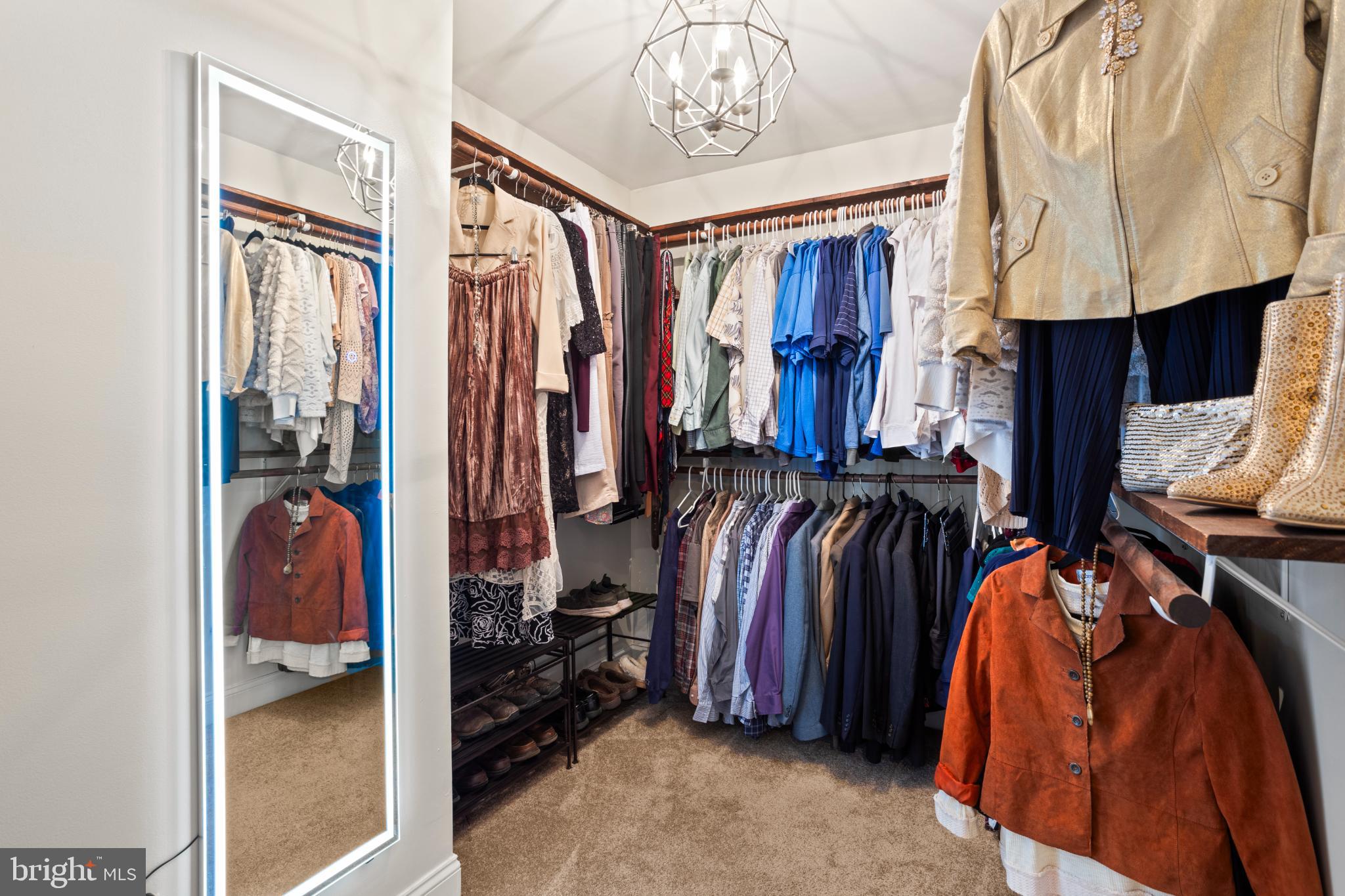 1860 Battery Lane Owings, MD 20736 - Photo 56 of 120 a view of walk in closet with clothes and shoes