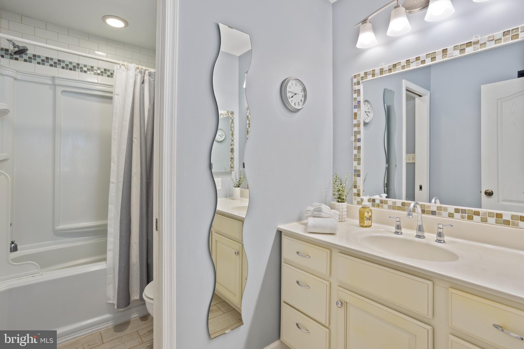 1860 Battery Lane Owings, MD 20736 - Photo 61 of 120 Upstairs Customized Bathroom with pocket door