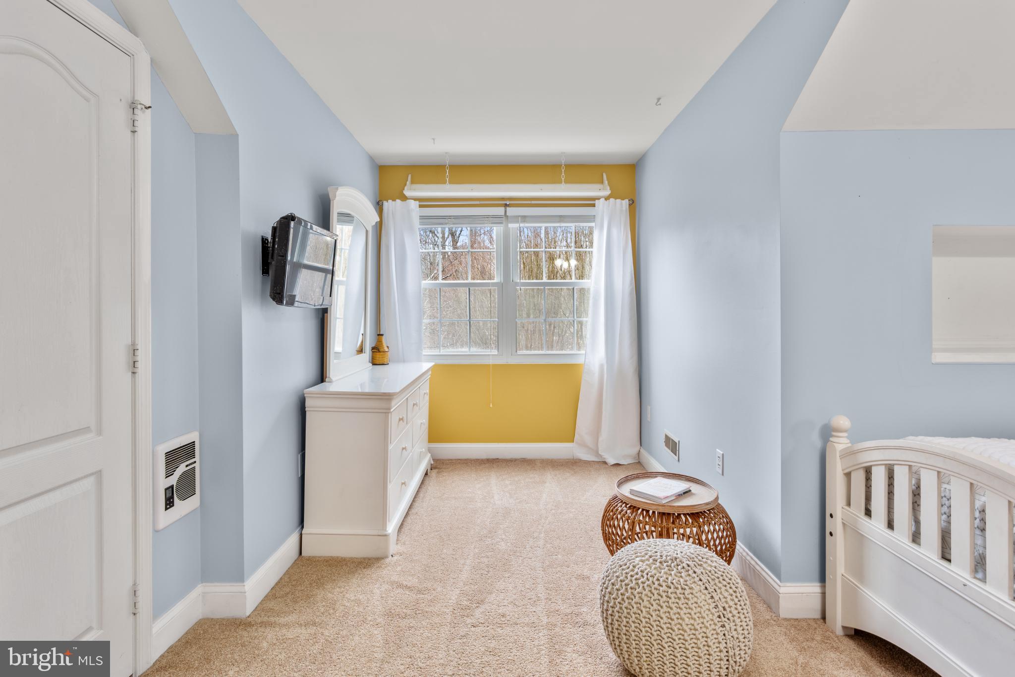 1860 Battery Lane Owings, MD 20736 - Photo 79 of 120 a bedroom with a bed and a window