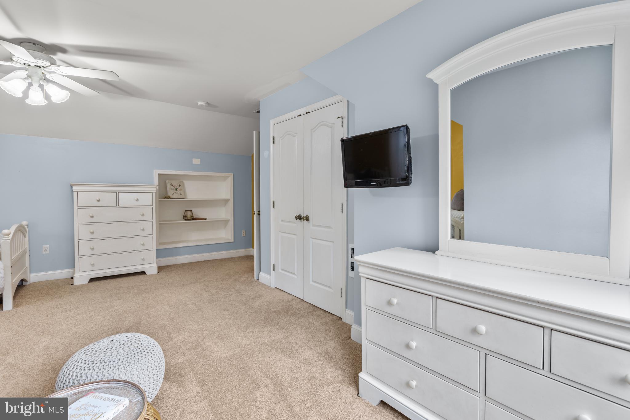 1860 Battery Lane Owings, MD 20736 - Photo 81 of 120 a living room with furniture and a flat screen tv