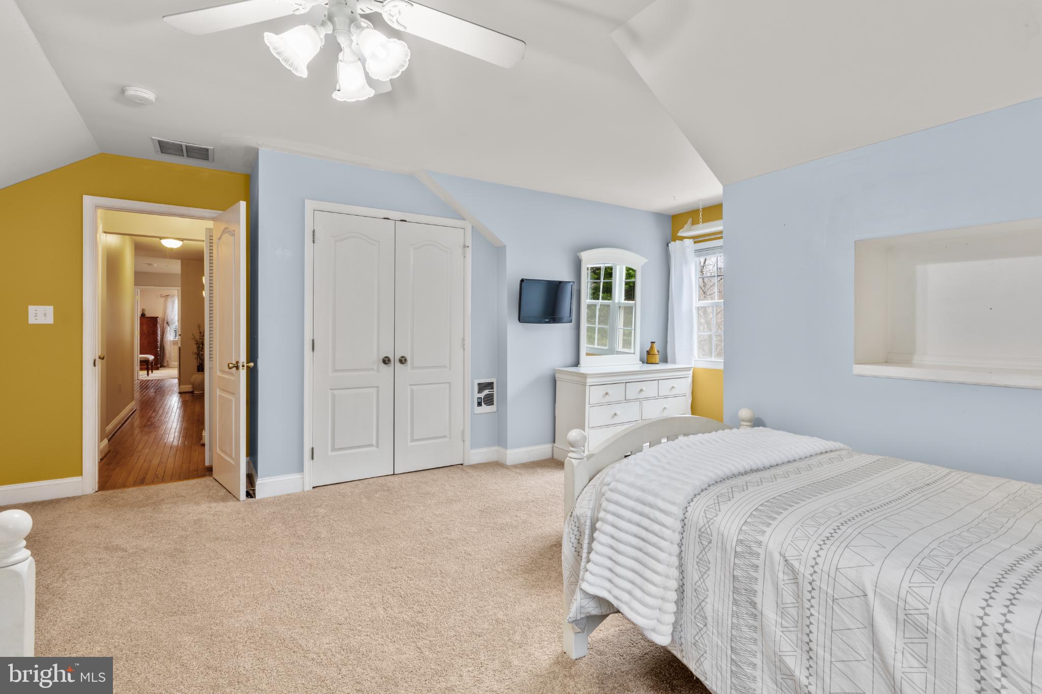1860 Battery Lane Owings, MD 20736 - Photo 83 of 120 a bedroom with a bed and a chandelier