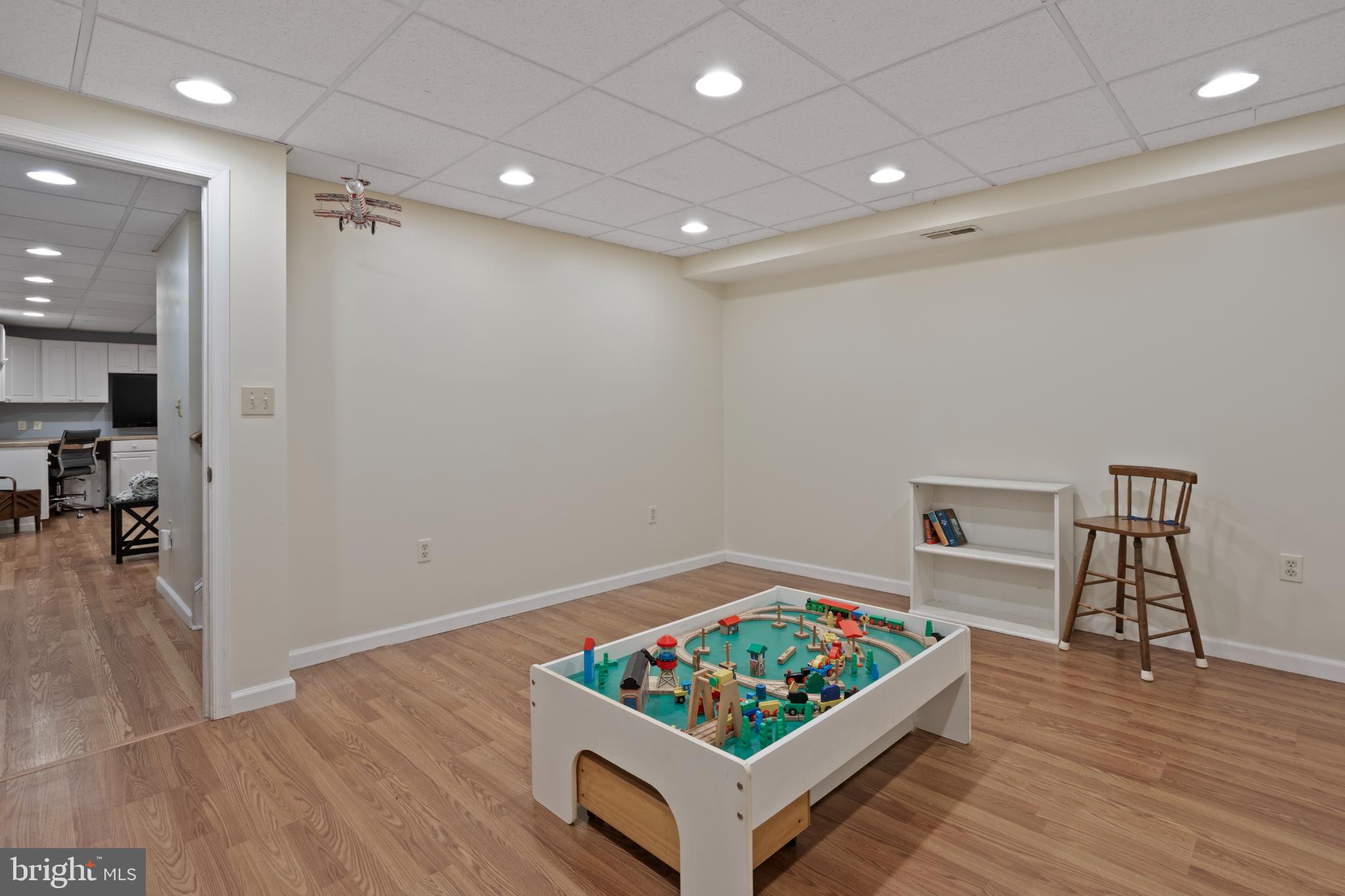 1860 Battery Lane Owings, MD 20736 - Photo 87 of 120 a living room with furniture and a wooden floor