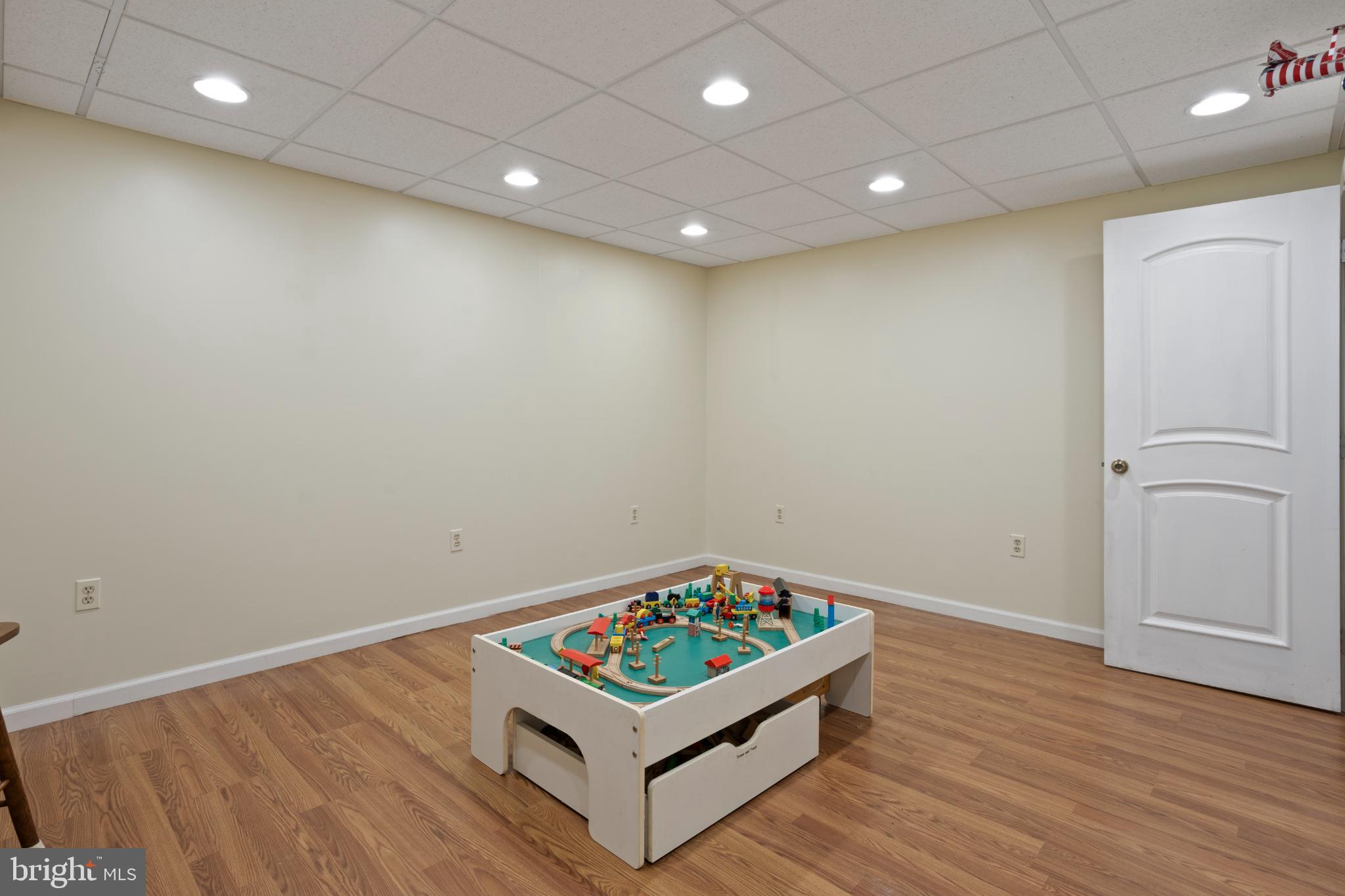 1860 Battery Lane Owings, MD 20736 - Photo 88 of 120 an empty room with wooden floor and window
